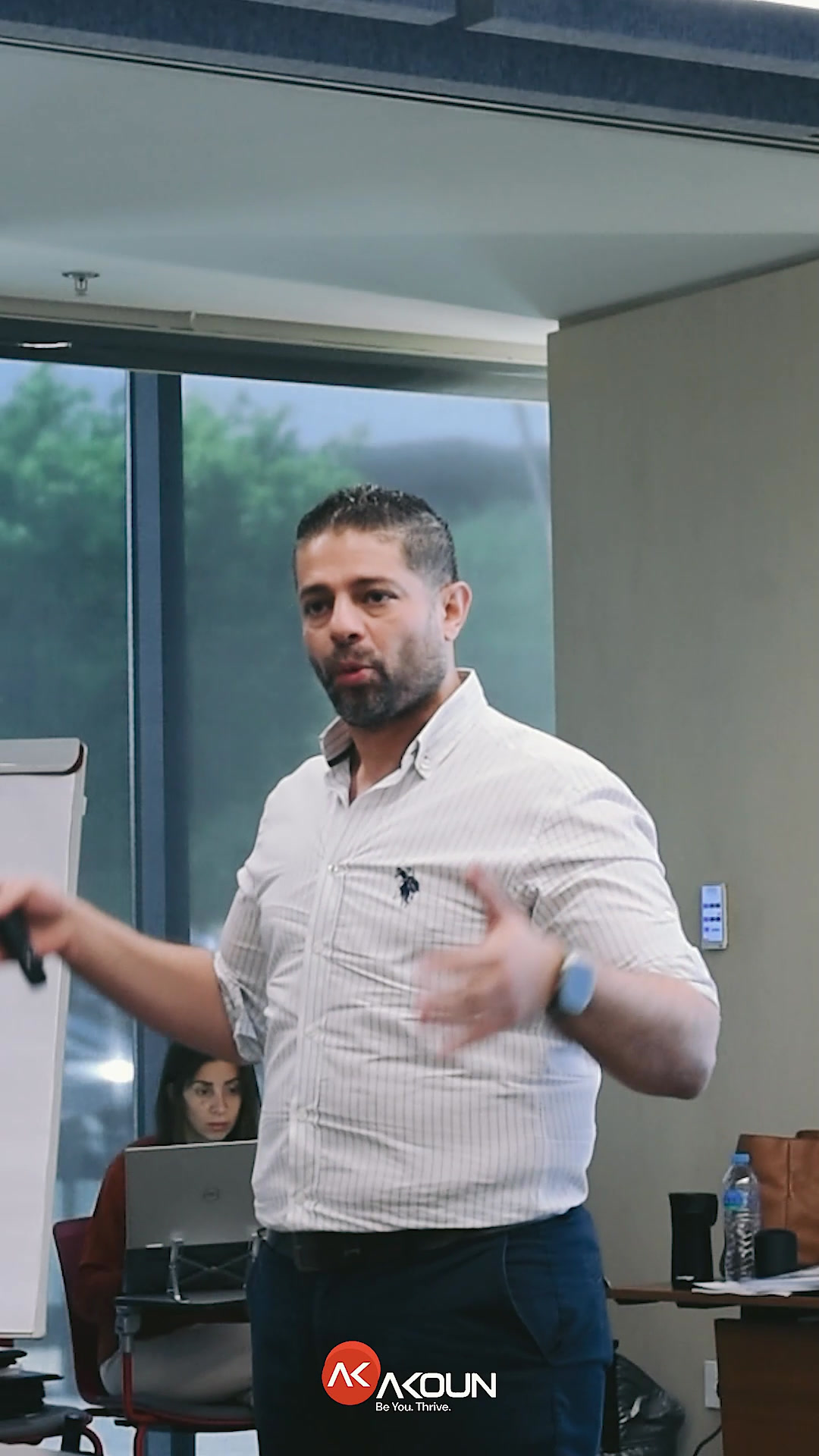 An AKOUN facilitator delivering a training session